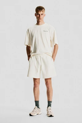 Mid-Length Sports Shorts with DryMove™