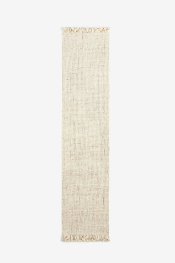 Tapis frangé en laine mélangée