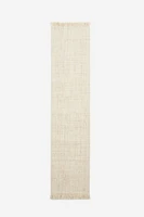 Tapis frangé en laine mélangée