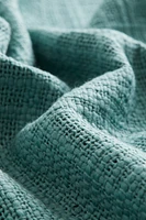 Housse de coussin en tissu flammé