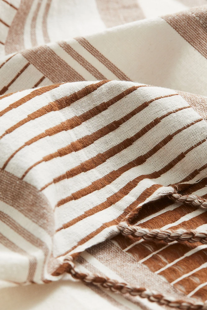 Serviette de plage en tissu jacquard