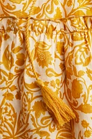 Robe à volant avec ceinture nouer