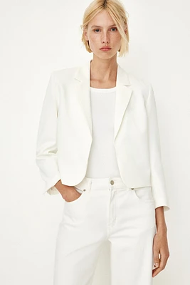 Blazer à poignets fendus