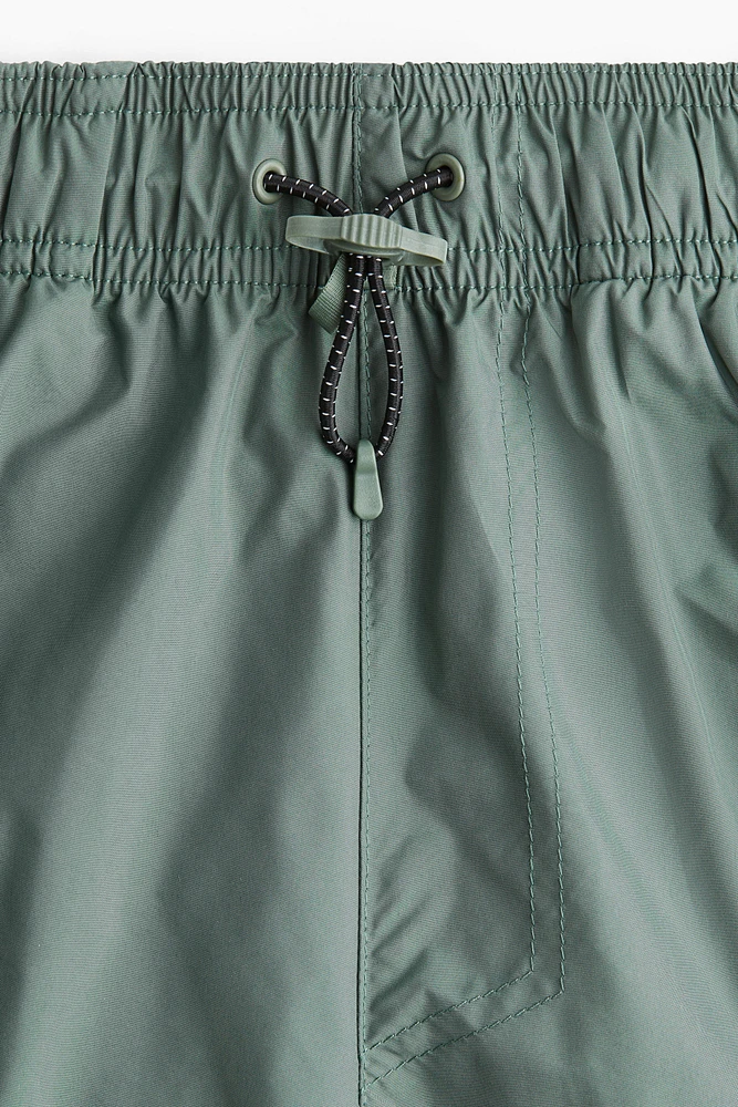 Short de sport long style cargo