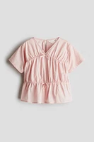 Blouse péplum en coton