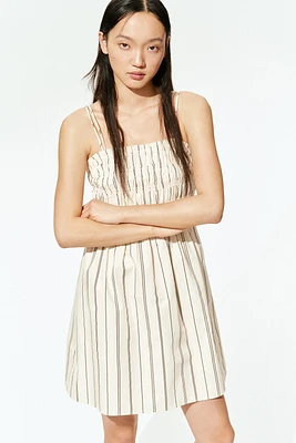 Robe en coton à corsage nid d'abeille