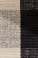 Tapis tissé à plat avec décor à carreaux