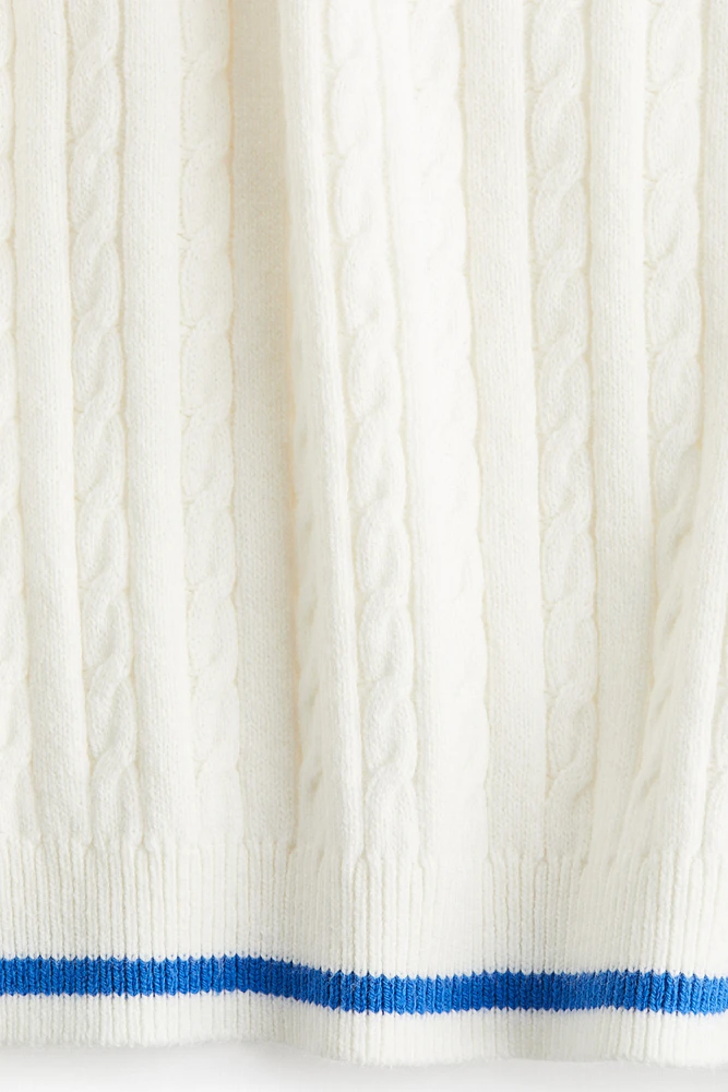 Haut en tricot torsadé
