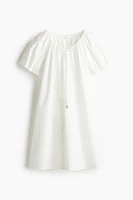 Robe avec cordon de serrage à l'encolure