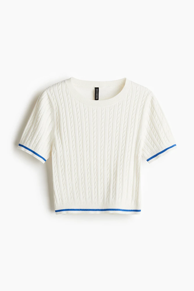 Haut en tricot torsadé