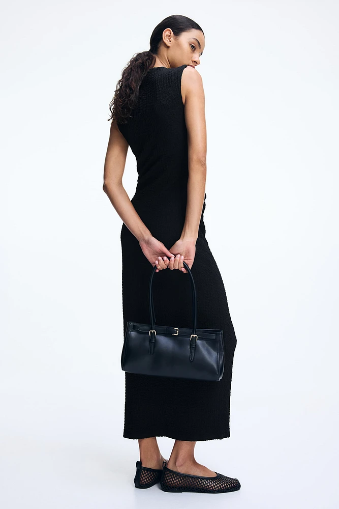 Robe moulante à effet drapé