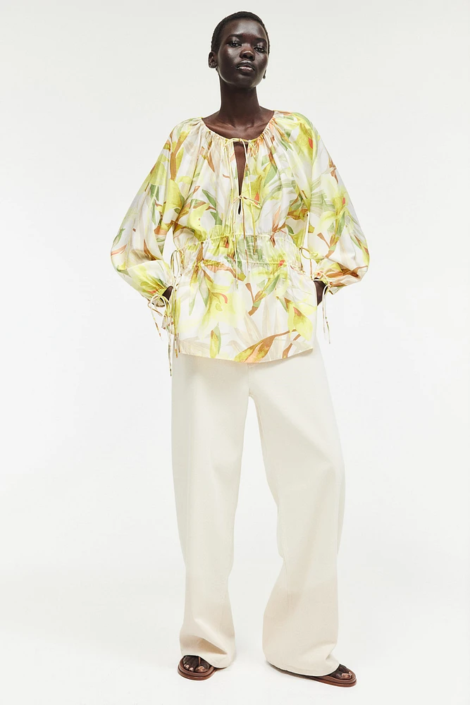 Blouse avec cordons de serrage