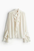 Flounce-Trimmed Tie-Neck Blouse