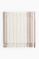 Serviette de plage en tissu jacquard