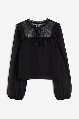 Blouse à manches bouffantes avec dentelle