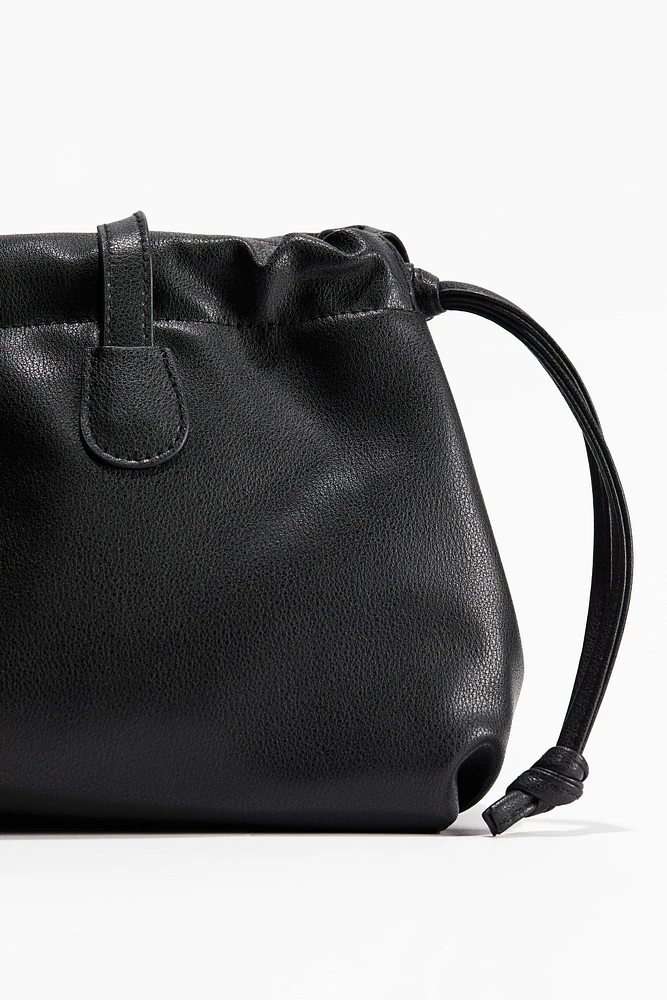 Sac bandoulière avec cordon de serrage