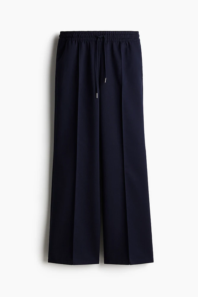 Pantalon avec cordon de serrage et plis