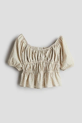 Blouse péplum en coton