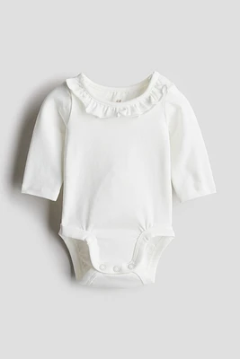 Combiné en coton avec col à volant