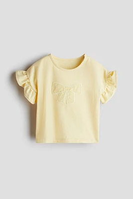 Haut en coton avec appliqués
