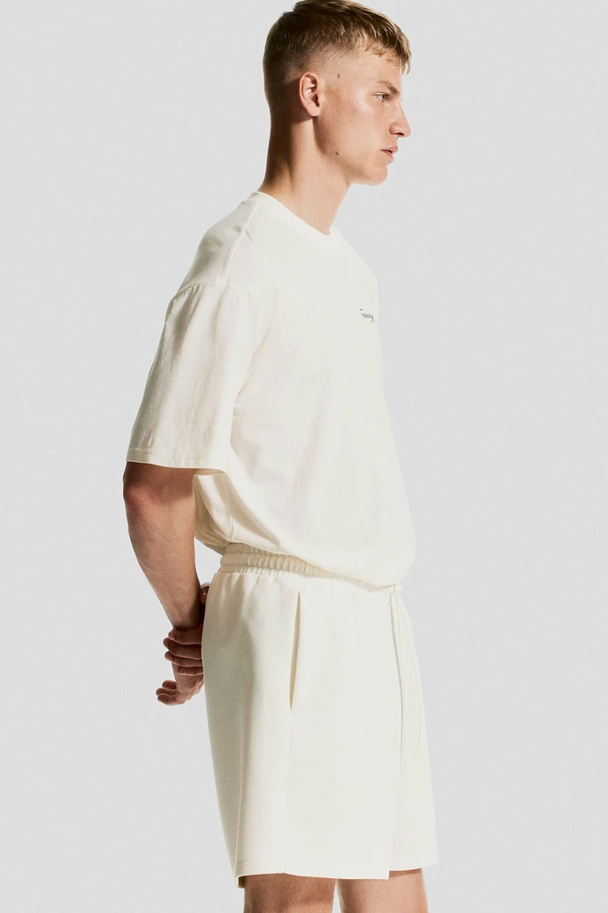 Mid-Length Sports Shorts with DryMove™