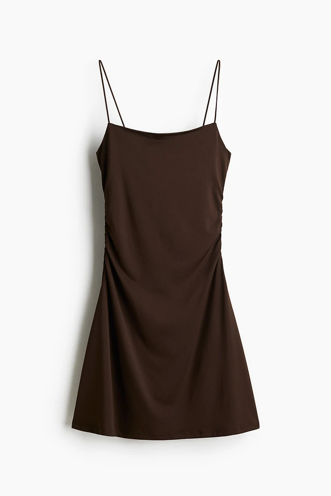 Robe combinaison à effet drapé