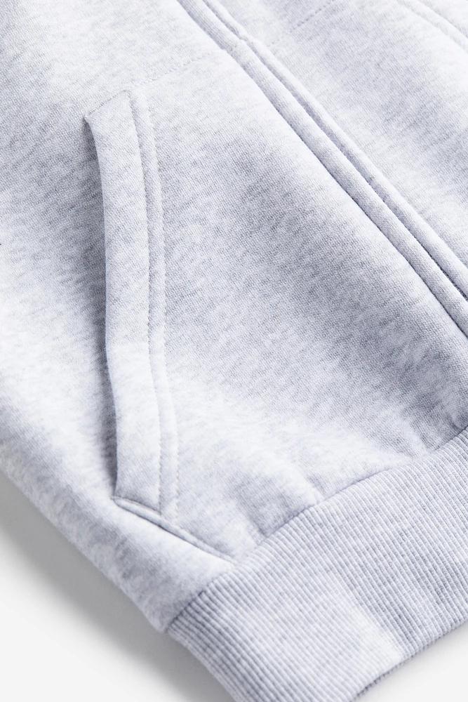 Veste grande taille à glissière avec capuchon