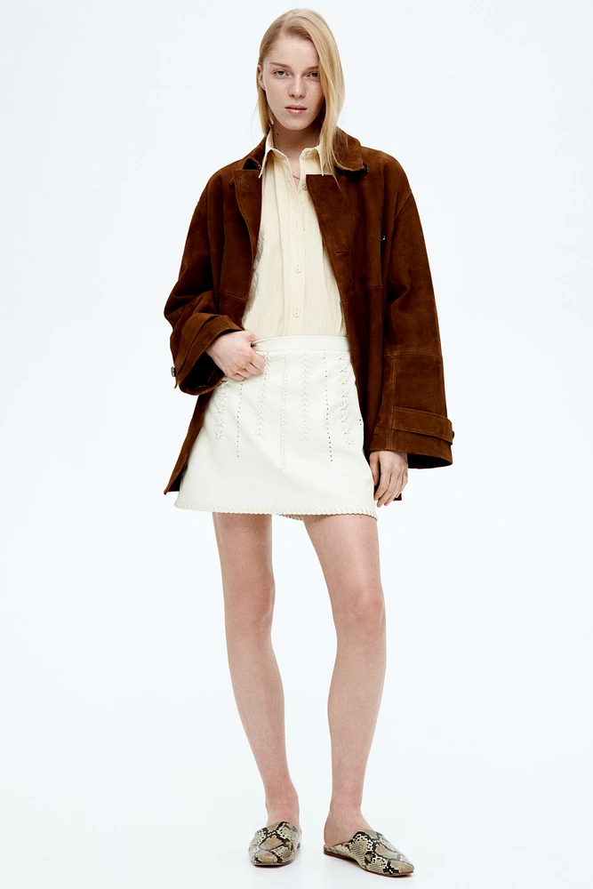 Veste à fermeture croisée en cuir velours