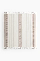 Serviette de plage en tissu jacquard