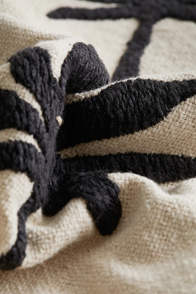 Housse de coussin brodée