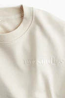 Sweatshirt with Text Motif