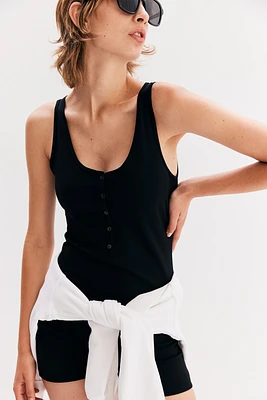 Combinaison avec patte de boutonnage