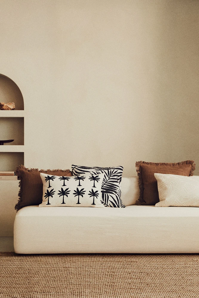 Housse de coussin brodée