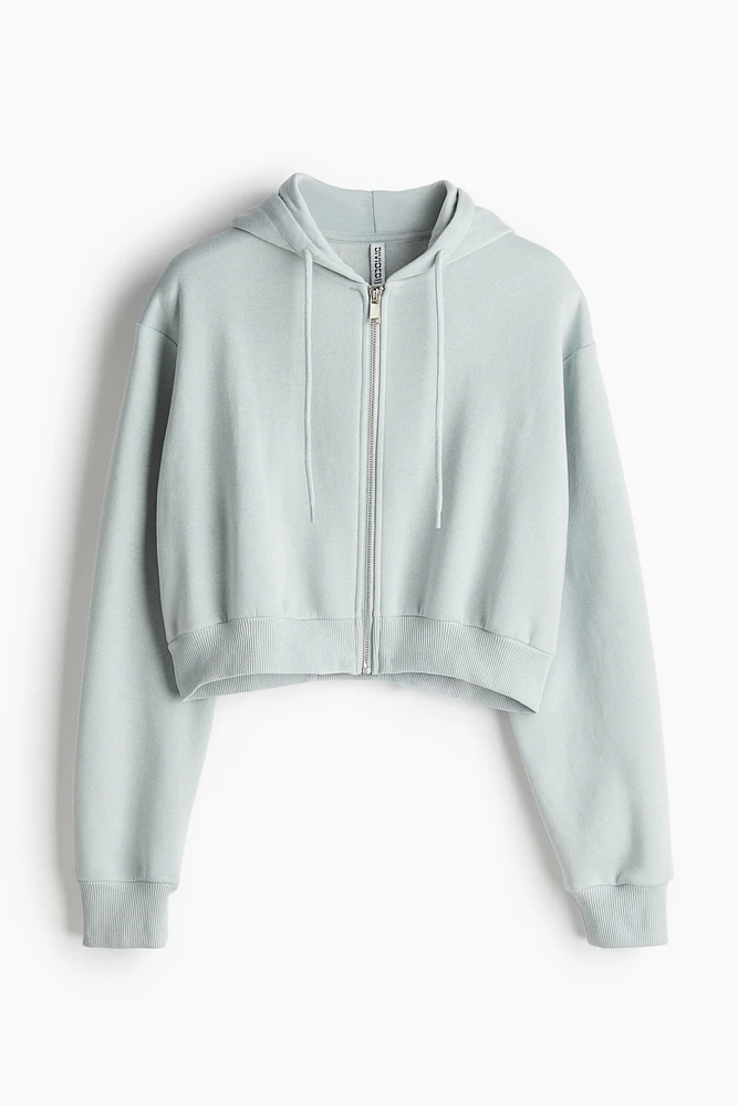 Veste courte avec capuchon et glissière