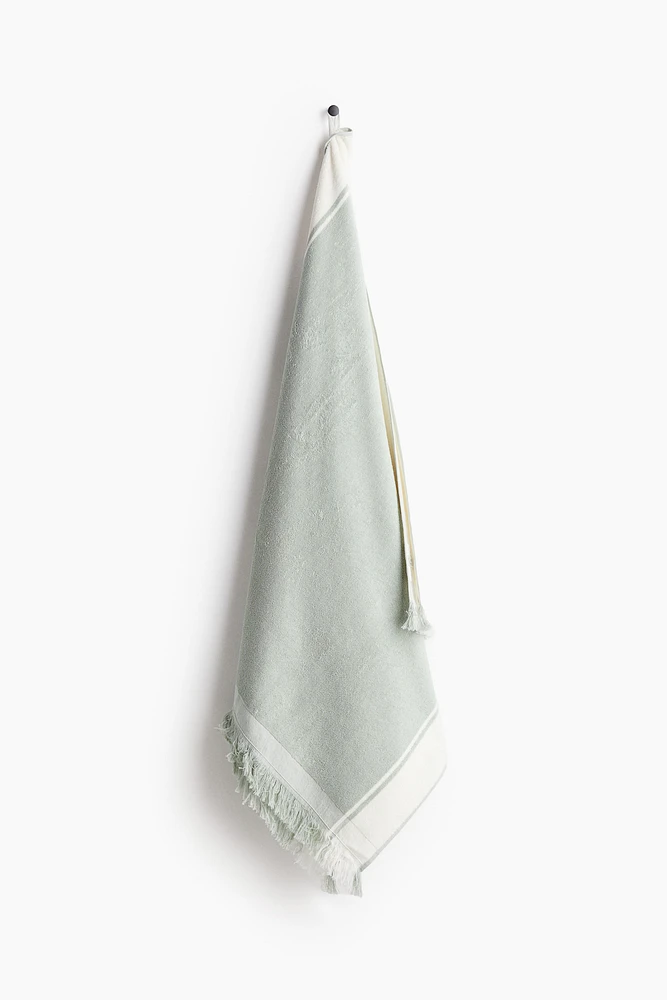 Serviette de plage frangée