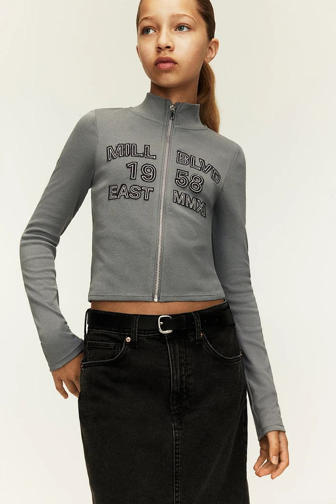 Veste à glissière avec motifs