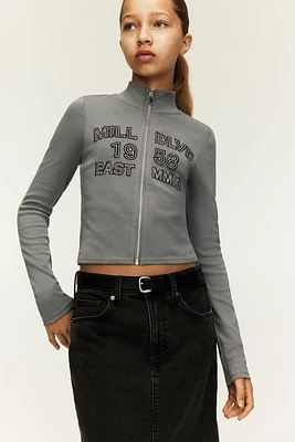Veste à glissière avec motifs