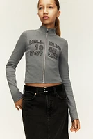 Veste à glissière avec motifs