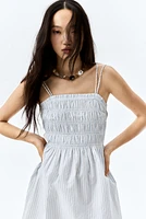 Robe en coton à corsage nid d'abeille