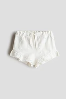 Short en jersey avec broderie anglaise