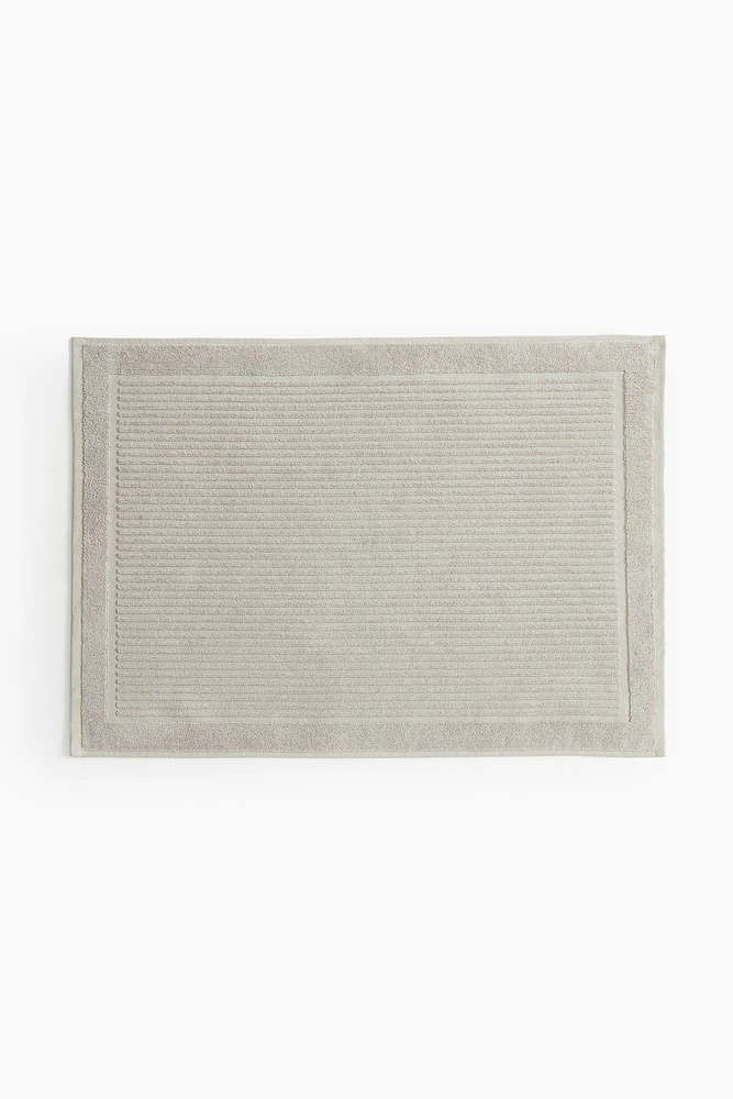 Tapis de bain en coton éponge