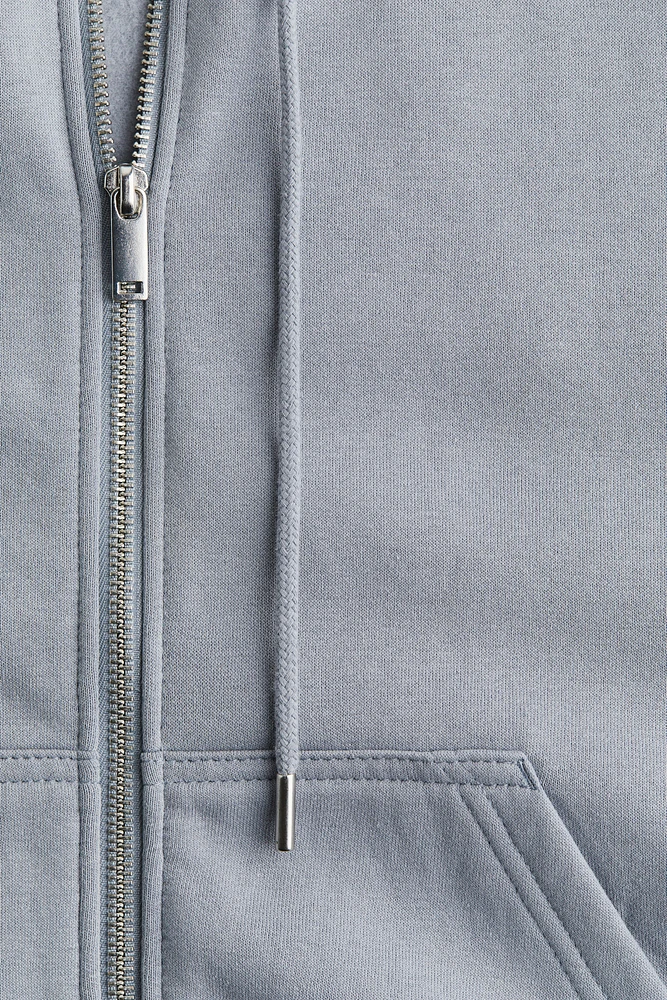 Veste à capuchon glissière