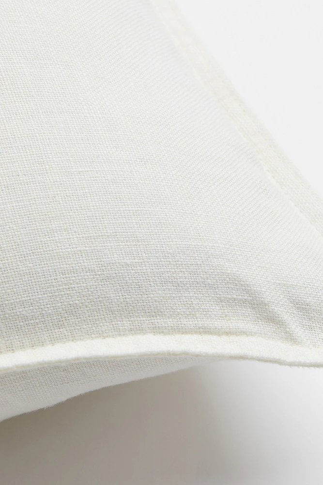 Housse de coussin en lin lavé