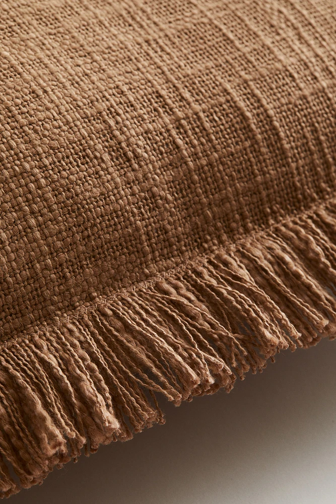 Housse de coussin en tissu flammé