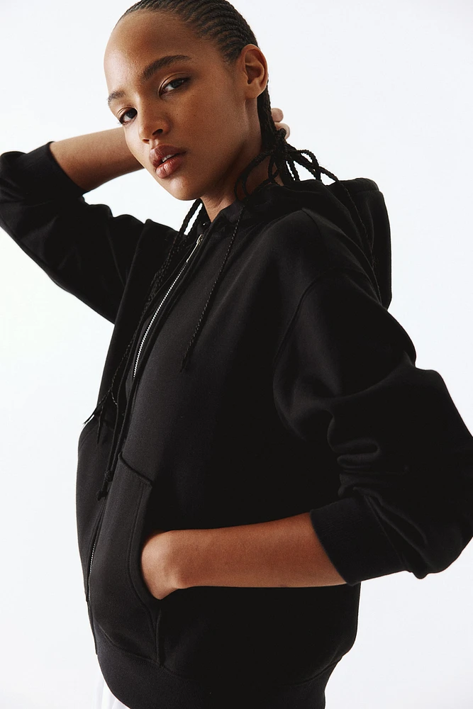 Veste à capuchon glissière