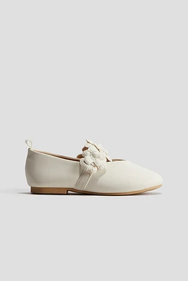 Appliquéd ballet pumps