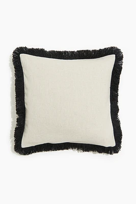 Housse de coussin frangée en lin mélangé