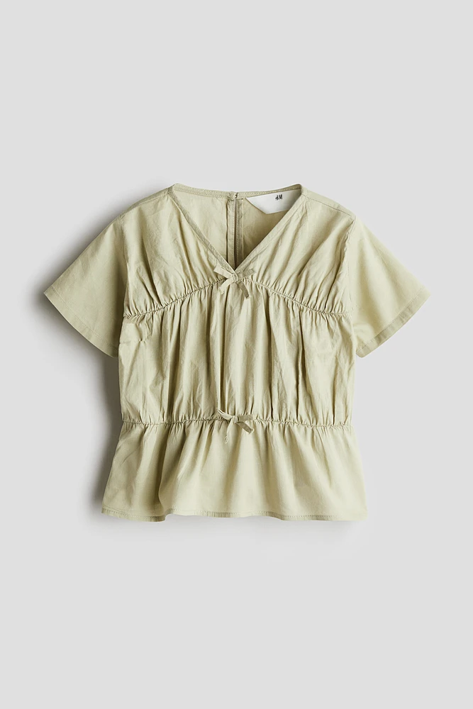 Blouse péplum en coton