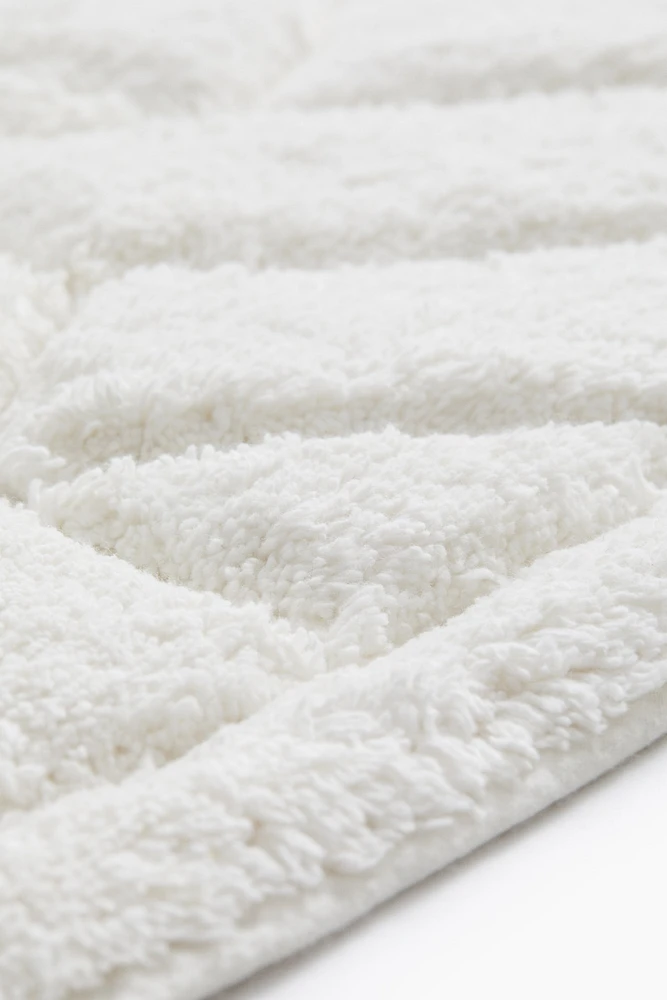 Tapis de bain en coton bouclé