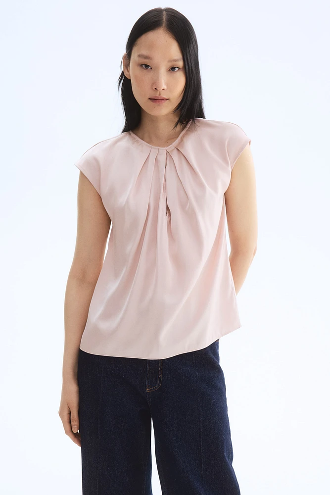 Blouse avec plis devant